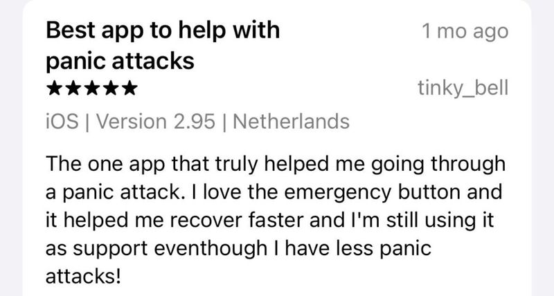 Five-star iOS App Store review titled "Best app to help with panic attacks" from user tinky_bell in the Netherlands, praising the emergency button